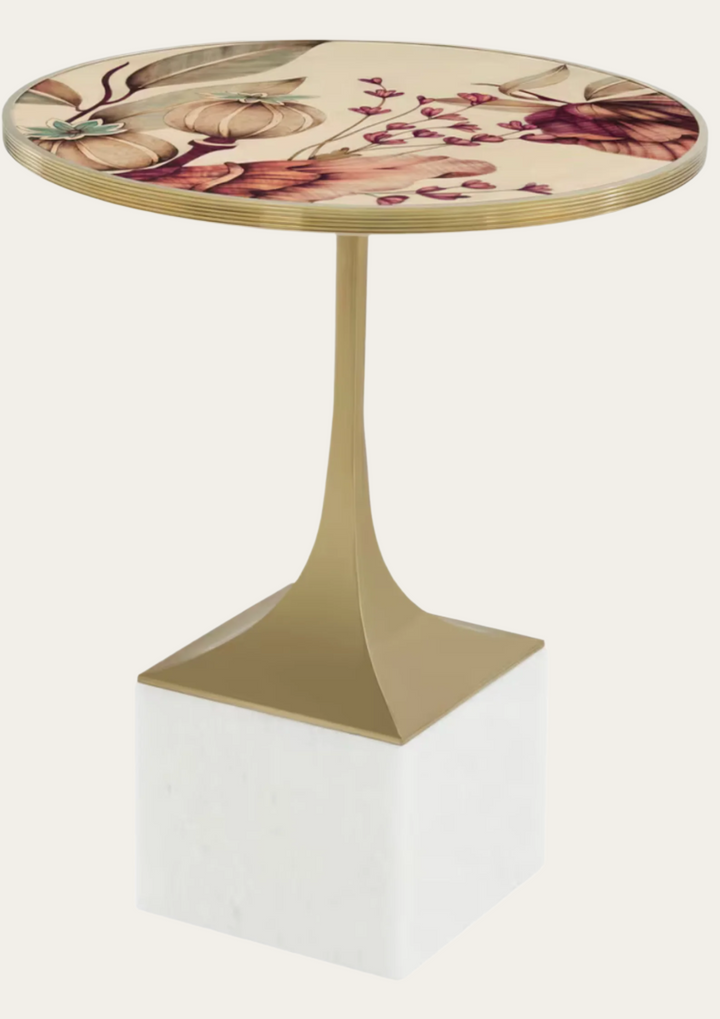 Decorative side table with floral design on the top and geometric base.