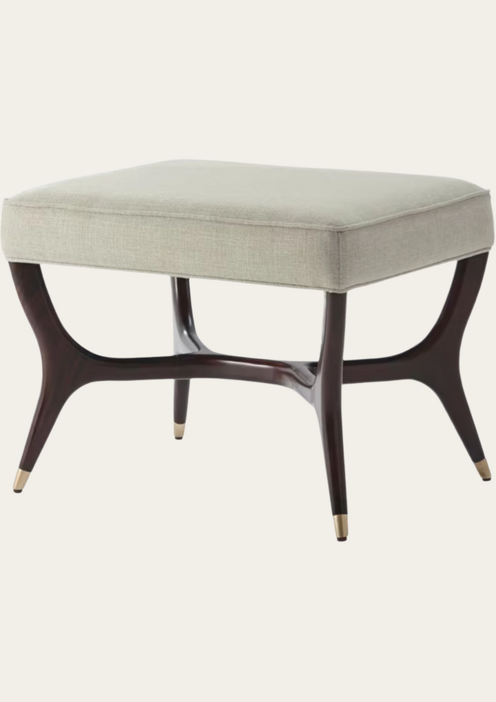 Square ottoman with a light gray cushion and dark wooden legs on a white background